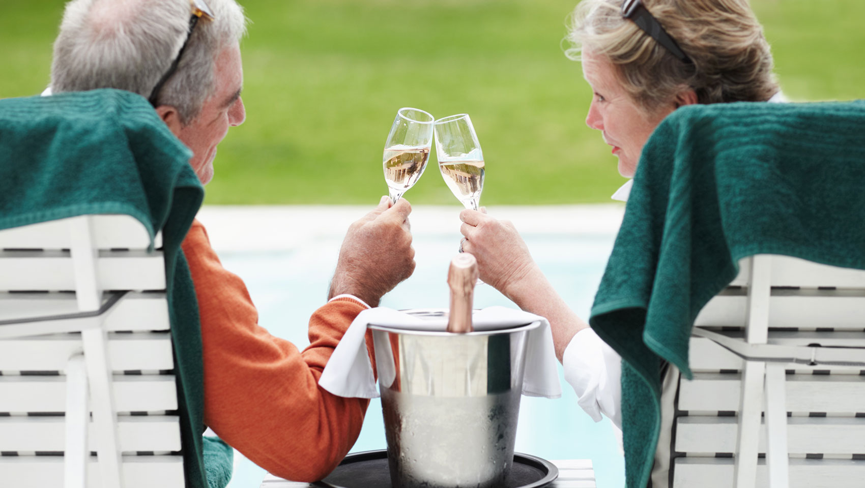 older couple toasting with wine