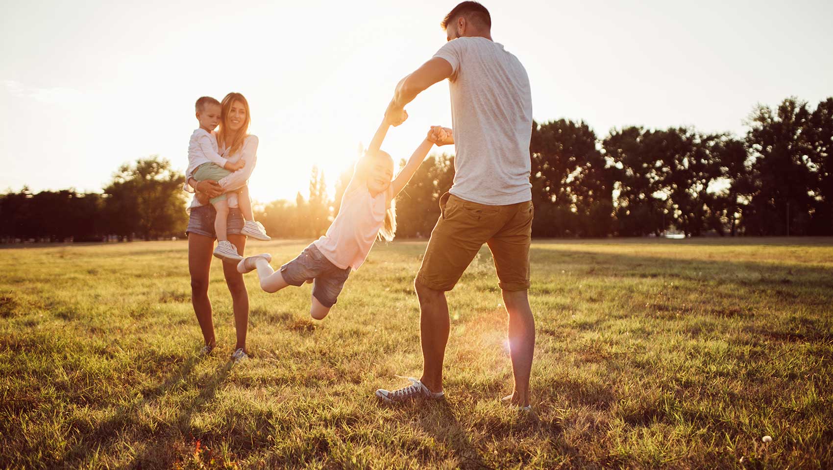 family playing on the grass